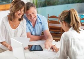 Happy mature Couple in Meeting With Advisor at home